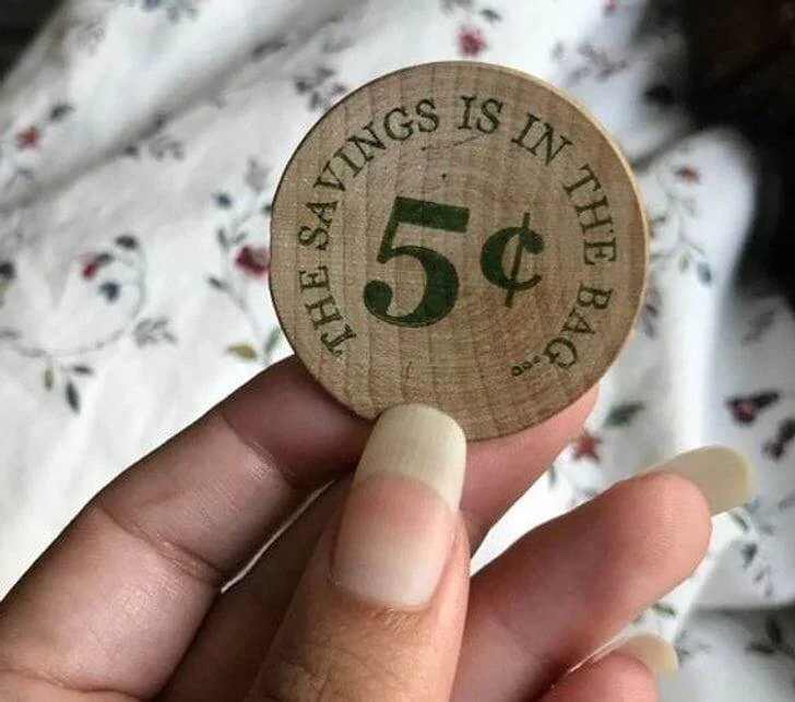 Wooden Discounts for Bag-Free Shoppers One store incentivizes eco-friendly shopping by giving wooden discount coupons to customers who bring their own bags instead of using plastic ones.