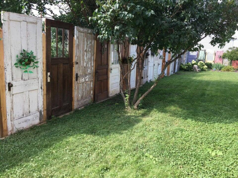Upcycled Fences from Old Doors Why buy new wood for your fence when you can creatively repurpose old doors? This idea not only looks unique but also helps divert waste from landfills.