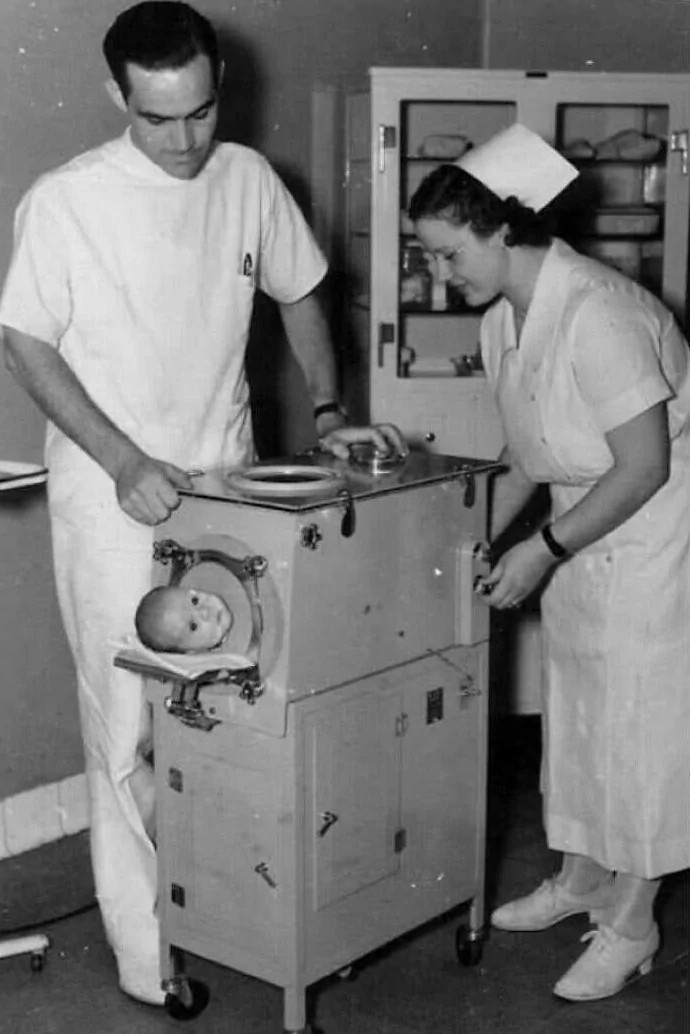 A Newborn's Struggle: A poignant snapshot from 1940 shows a newborn suffering from polio, reliant on a small ventilator for survival.